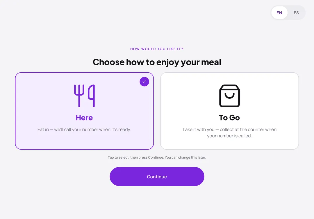 Kiosk screen asking guests to choose Here or To Go, with a Continue button